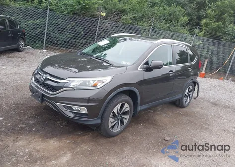 2015 Honda Cr-V Touring z USA, uszkodzony, nr VIN 5J6RM4H90FL014889